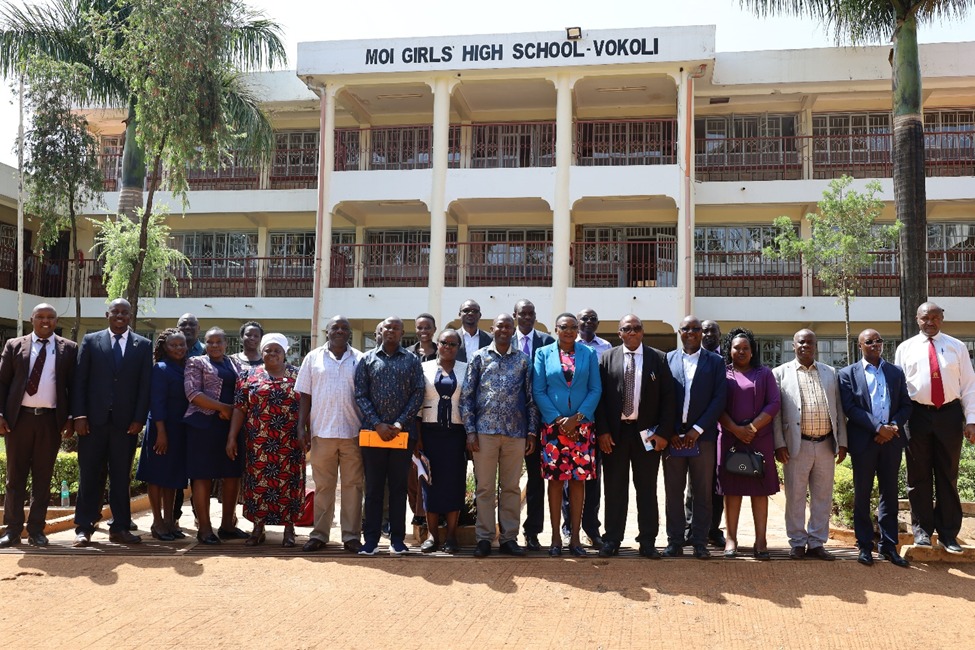 Members of the University Council pose for a group photo at Moi Girls Vokoli during the familiarization tour of the proposed site for the Moses Mudavadi - College of Health Sciences.