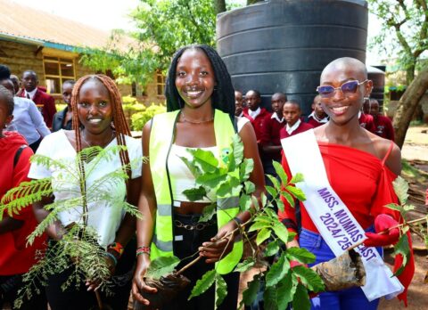 KAFU models join other participants in planting trees during the environmental sustainability initiative at Ruiru Boys High School.