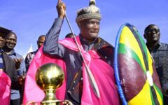 National Treasury and Economic Planning Cabinet Secretary John Mbadi receives a traditional Kuria hat, shield and spear from Kuria elders during the women empowerment programme in Kuria East, Migori County.