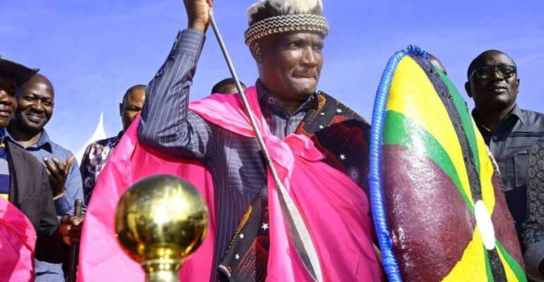 National Treasury and Economic Planning Cabinet Secretary John Mbadi receives a traditional Kuria hat, shield and spear from Kuria elders during the women empowerment programme in Kuria East, Migori County.